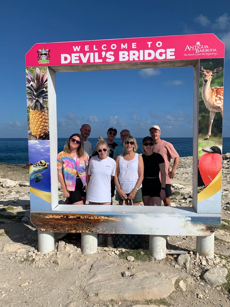 Large group visiting Devil's Bridge in Antigua